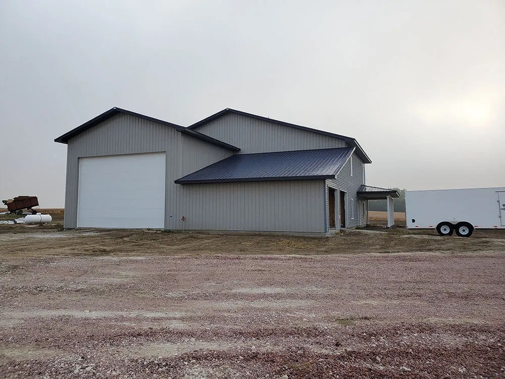 A completed shouse with a large garage door